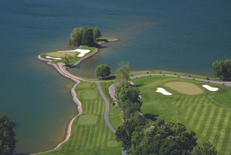 An aerial view of the signature island green at The Water's Edge Country Club at Smith Mountain Lake, VA