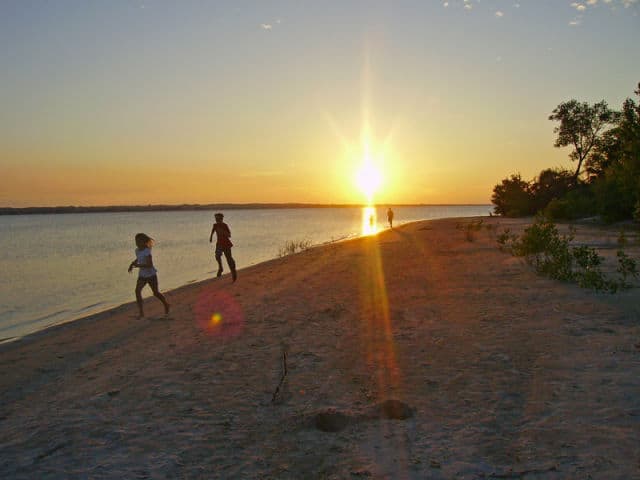 Sandy beach run at sunset on Calamus Lake