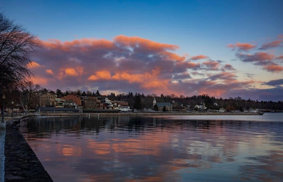 Clouds form over Skaneateles Lake, Skaneateles, a popular vacation destination in the Finger Lakes Region of New York State, USA, before sunset on a winter day.